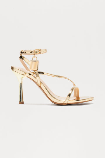 Bebe Lock Patent Heels - Gold